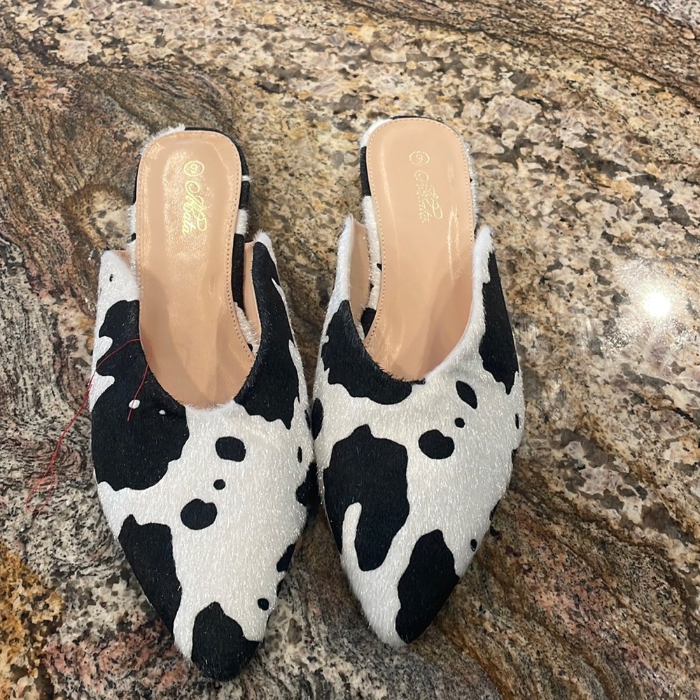 Cow print faux fur mules